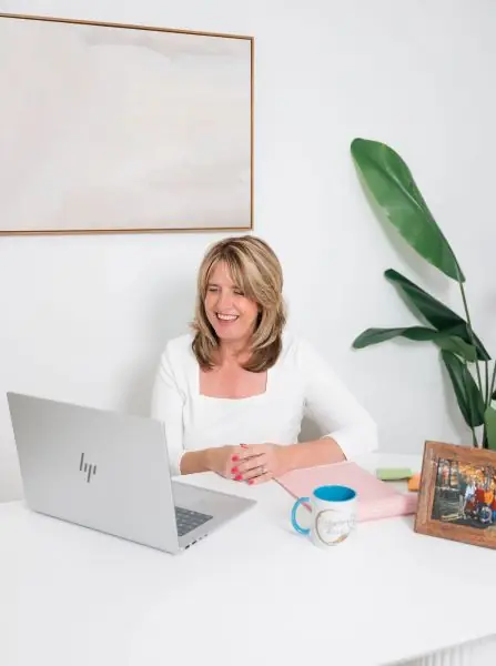 Kris Kryder at her desk in the Kryder Cares office